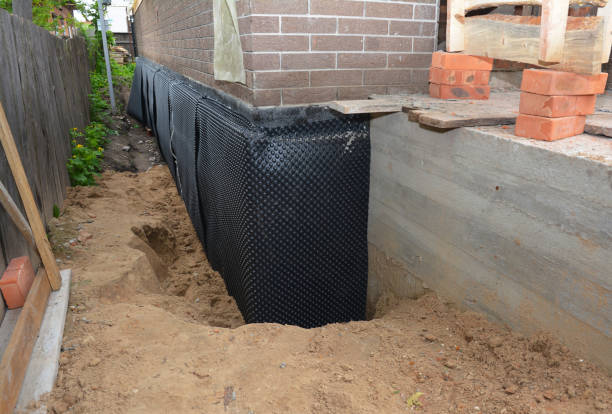 SJ Waterproofing Pros technician performing targeted Basement Waterproofing assessment in Meridian, NY